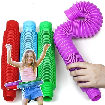 8pcs Plástico Colorido Pop Tubo de Bobina Criativo para Crianças Mágica de Brinquedos Círculo Brinquedos Engraçados inicial de Desenvolvimento Educacional de Dobramento de Brinquedo